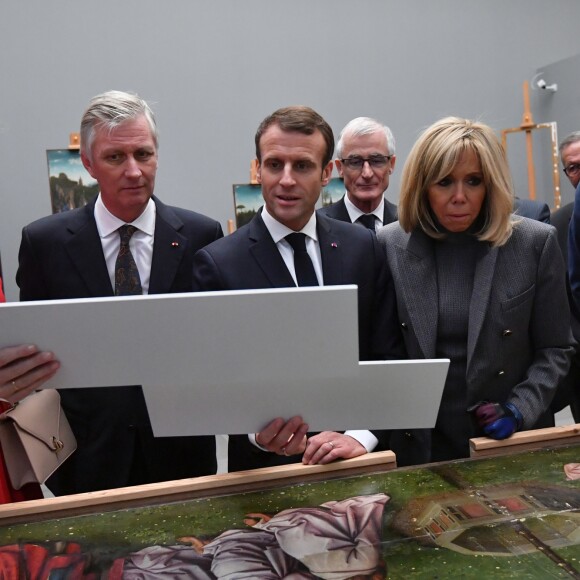 Le président de la République française Emmanuel Macron, sa femme la Première Dame Brigitte Macron, le roi Philippe de Belgique, la reine Mathilde de Belgique et le Premier ministre Charles Michel visitent l'atelier de restauration de "l'Adoration de l'Agneau Mystique" au MSK de Gand (Musée des Beaux-Arts), Belgique, le 19 novembre 2018, lors de la visite d'Etat du couple présidentiel en Belgique. © Emmanuel Dunand/Pool/Bestimage