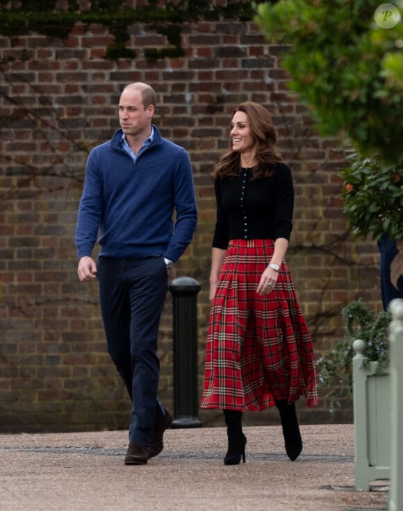 Le prince William, duc de Cambridge, et Catherine Kate Middleton, duchesse de Cambridge, arrivent à une fête de Noël pour le personnel de la RAF (Royal Air Force) Coningsby et Marham à Londres le 4 décembre 2018.