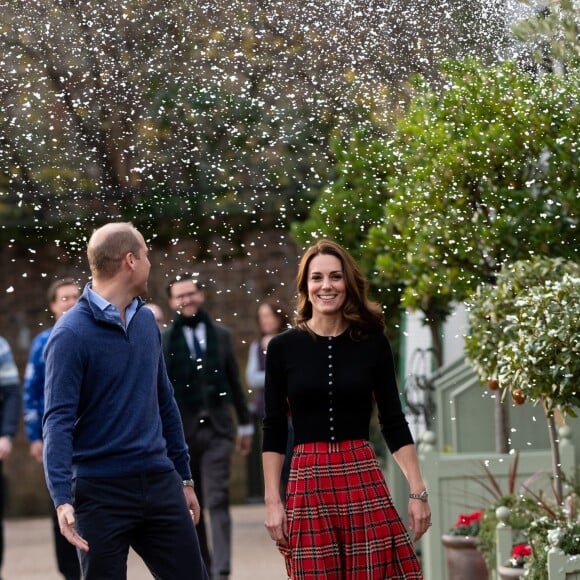 Le prince William, duc de Cambridge, et Catherine Kate Middleton, duchesse de Cambridge, arrivent à une fête de Noël pour le personnel de la RAF (Royal Air Force) Coningsby et Marham à Londres le 4 décembre 2018.