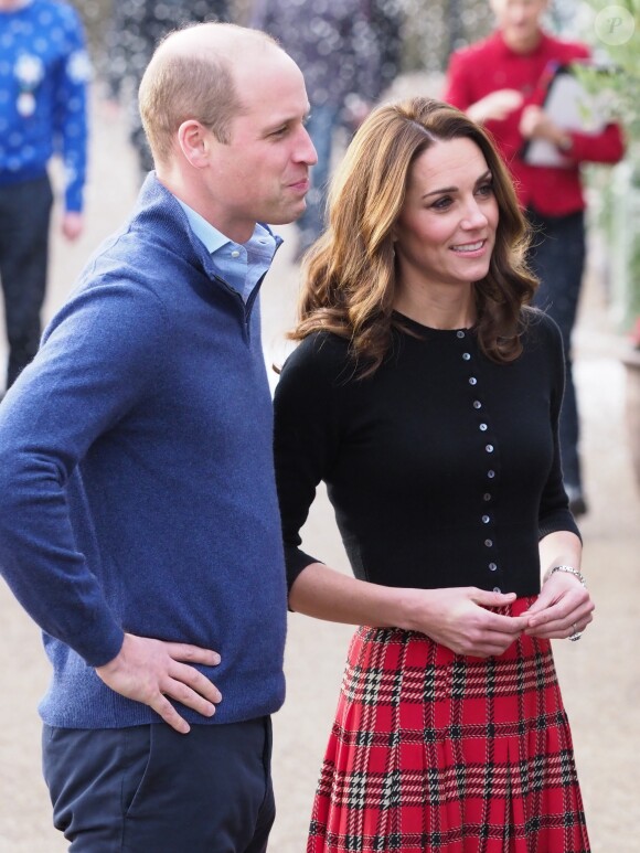 Le prince William, duc de Cambridge, et Catherine Kate Middleton, duchesse de Cambridge, arrivent à une fête de Noël pour le personnel de la RAF (Royal Air Force) Coningsby et Marham à Londres le 4 décembre 2018.