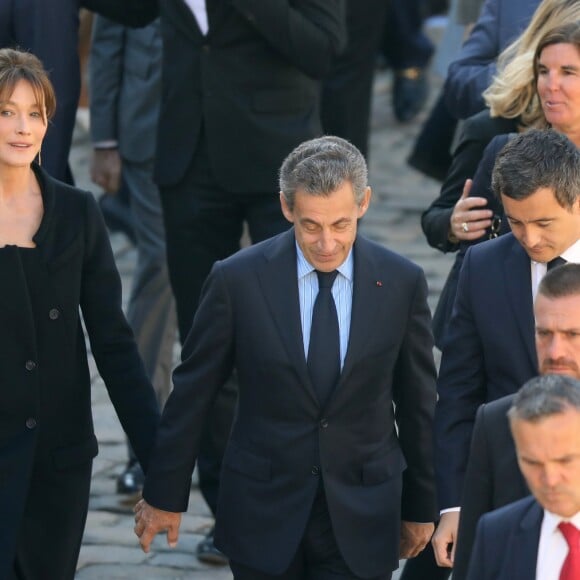 Carla Bruni Sarkozy et Nicolas Sarkozy, Gérald Darmanin - Arrivées à l'hommage national à Charles Aznavour à l'Hôtel des Invalides à Paris. Le 5 octobre 2018 © Jacovides-Moreau / Bestimage