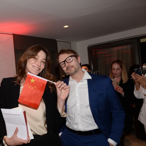 Exclusif - Carla Bruni Sarkozy (invitée d'honneur) et l'artiste peintre Julien Marinetti - Déjeuner "Chinese Business Club" au Pavillon Gabriel à Paris, à l'occasion de la journée des droits des femmes, le 8 mars 2019 © Rachid Bellak / Bestimage