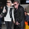 Johnny Hallyday, Laeticia et leurs filles Jade et Joy arrivent a l'aeroport de Los Angeles avec leur chien Santos le 10 fevrier 2013.