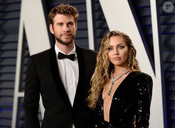 Miley Cyrus et son mari Liam Hemsworth à la soirée Vanity Fair Oscar Party à Los Angeles, le 24 février 2019.