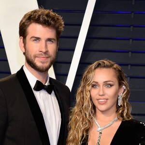 Miley Cyrus et son mari Liam Hemsworth à la soirée Vanity Fair Oscar Party à Los Angeles, le 24 février 2019.