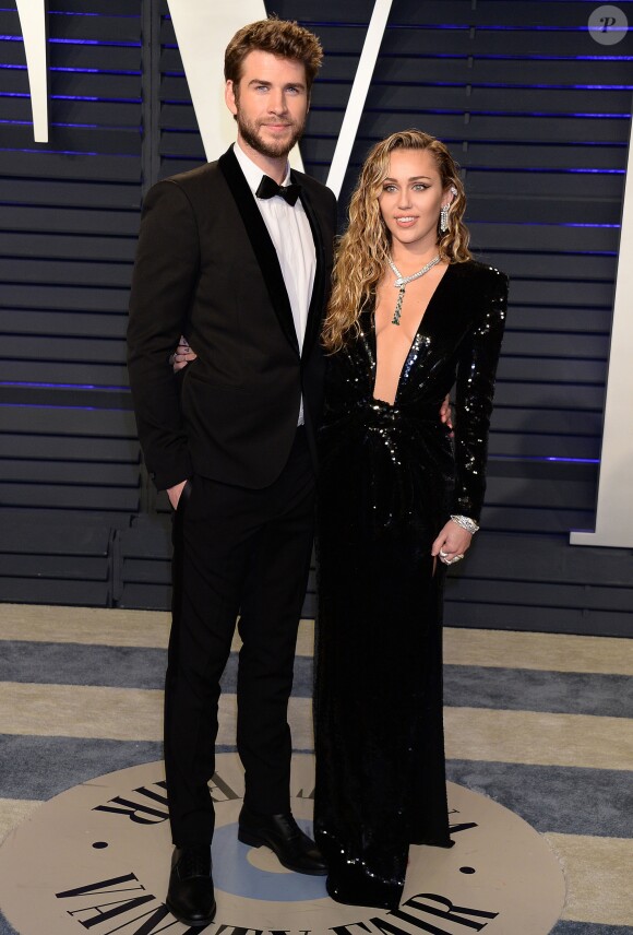 Miley Cyrus et son mari Liam Hemsworth à la soirée Vanity Fair Oscar Party à Los Angeles, le 24 février 2019.