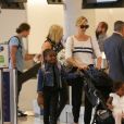 Exclusif - Charlize Theron arrive avec ses enfants Jackson et August à l'aéroport LAX de Los Angeles, Californie, Etats-Unis, le 13 août 2018