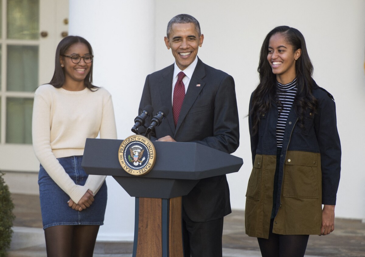 Photo : Barack Obama entouré de ses deux filles, Natasha et Malia