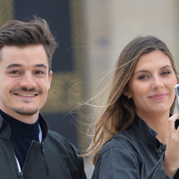 Exclusif - Camille Cerf (Miss France 2015) et son compagnon Cyrille participent à l'animation "Smash Perrier" dans la cadre des Internationaux de France de Roland-Garros 2019, à Paris, France, le 29 mai 2019. En lien avec le tournoi de Roland Garros, Perrier installe une tyrolienne sur la Tour Eiffel du 5 au 11 juin. Le Smash Perrier, c'est s'élancer depuis le deuxième étage de la Tour Eiffel et atterrir à Ecole Militaire une minute plus tard, en tyrolienne ! Comme un smash au tennis en somme, avec une vitesse moyenne de 90 km/h. © Veeren/Bestimage  (No Web pour la Belgique et la Suisse) Exclusive - Celebs participate in the animation "Smash Perrier" as part of the French Open at Roland Garros 2019. In connection with the Roland Garros tournament, Perrier installs a zip line on the Eiffel Tower from 5 to 11 June. The Smash Perrier is to start from the second floor of the Eiffel Tower and land at Ecole Militaire a minute later, zip line! Like a tennis smash, with an average speed of 90 km/h. Paris, May 29th, 2019.29/05/2019 - Paris