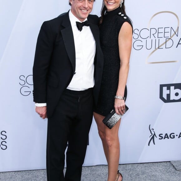 Hugh Grant et sa femme Anna Elisabet Eberstein - Photocall - 25ème cérémonie annuelle des Screen Actors Guild Awards au Shrine Audritorium à Los Angeles, le 27 janvier 2019.