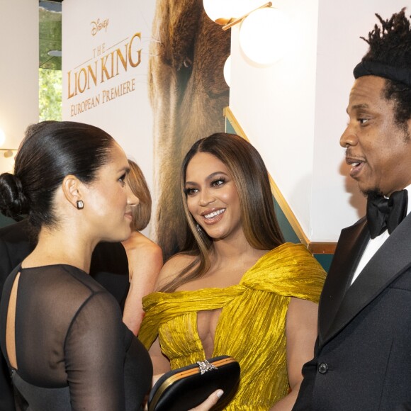 Le prince Harry, duc de Sussex, et Meghan Markle, duchesse de Sussex, avec Jay-Z et sa femme Beyonce Knowles à la première du film "Le Roi Lion" au cinéma Odeon Luxe Leicester Square à Londres, le 14 juillet 2019.