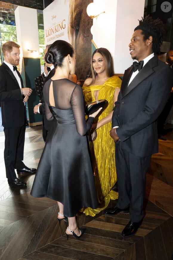 Le prince Harry, duc de Sussex, et Meghan Markle, duchesse de Sussex, avec Jay-Z et sa femme Beyonce Knowles à la première du film "Le Roi Lion" au cinéma Odeon Luxe Leicester Square à Londres, le 14 juillet 2019.