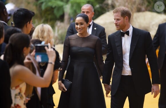 Le prince Harry, duc de Sussex, et Meghan Markle, duchesse de Sussex, à la première du film "Le Roi Lion" au cinéma Odeon Luxe Leicester Square à Londres, le 14 juillet 2019.