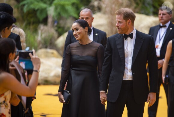Le prince Harry, duc de Sussex, et Meghan Markle, duchesse de Sussex, à la première du film "Le Roi Lion" au cinéma Odeon Luxe Leicester Square à Londres, le 14 juillet 2019.