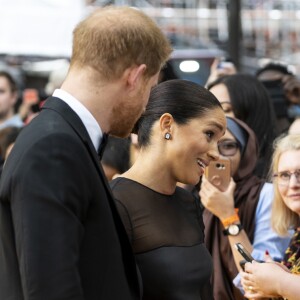 Le prince Harry, duc de Sussex, et Meghan Markle, duchesse de Sussex, à la première du film "Le Roi Lion" au cinéma Odeon Luxe Leicester Square à Londres, le 14 juillet 2019.