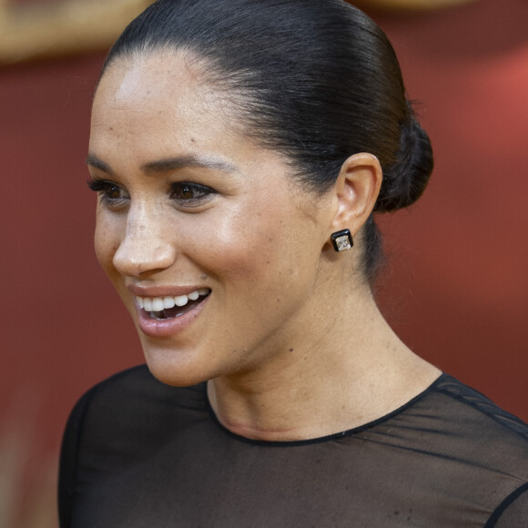 Le prince Harry, duc de Sussex, et Meghan Markle, duchesse de Sussex, à la première du film "Le Roi Lion" au cinéma Odeon Luxe Leicester Square à Londres, le 14 juillet 2019.