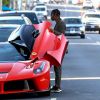 Exclusif - Travis Scott monte dans sa Ferrari rouge dans le quartier de West Hollywood à Los Angeles, le 22 juillet 2019.
