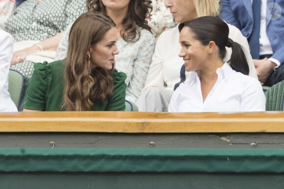 Catherine (Kate) Middleton, duchesse de Cambridge, Meghan Markle, duchesse de Sussex, et Pippa Middleton dans les tribunes lors de la finale femme de Wimbledon "Serena Williams - Simona Halep (2/6 - 2/6) à Londres, le 13 juillet 2019. © Ray Tang/London