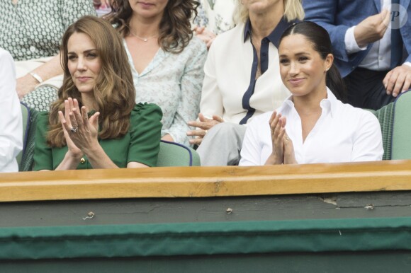 Catherine (Kate) Middleton, duchesse de Cambridge, Meghan Markle, duchesse de Sussex, et Pippa Middleton dans les tribunes lors de la finale femme de Wimbledon "Serena Williams - Simona Halep (2/6 - 2/6) à Londres, le 13 juillet 2019. © Ray Tang/London