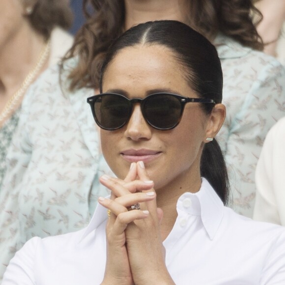 Catherine (Kate) Middleton, duchesse de Cambridge, Meghan Markle, duchesse de Sussex, et Pippa Middleton dans les tribunes lors de la finale femme de Wimbledon "Serena Williams - Simona Halep (2/6 - 2/6) à Londres, le 13 juillet 2019. © Ray Tang/London
