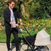 Norman Thavaud pose avec son bébé au cours d'une balade en poussette. Instagram, le 31 mars 2019.