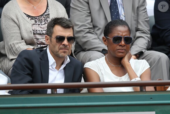 Marie-José Pérec et Sébastien Foucras - People dans les tribunes des Internationaux de France de tennis de Roland Garros à Paris. Le 1er juin 2015.