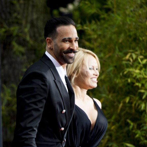 Adil Rami et sa compagne Pamela Anderson arrivent à la 28ème cérémonie des trophées UNFP (Union nationale des footballeurs professionnels) au Pavillon d'Armenonville à Paris, France, le 19 mai 2019.