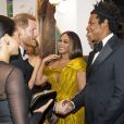 Le prince Harry, duc de Sussex, et Meghan Markle, duchesse de Sussex, avec Jay-Z et sa femme Beyonce Knowles à la première du film "Le Roi Lion" au cinéma Odeon Luxe Leicester Square à Londres, le 14 juillet 2019.