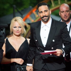 Adil Rami et Pamela Anderson arrivent à la 28ème cérémonie des trophées UNFP (Union nationale des footballeurs professionnels) au Pavillon d'Armenonville à Paris, France, le 19 mai 2019.