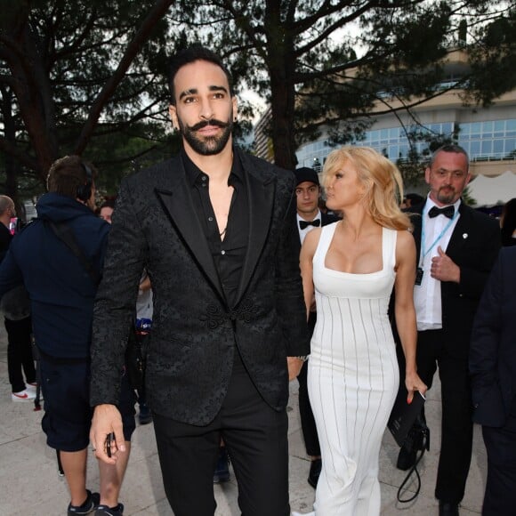 Pamela Anderson et Adil Rami lors de la soirée Amber Lounge Monaco 2019 au profit de la fondation de Jackie Stewart "Race Against Dementia" à l'hôtel Méridien Beach Plaza à Monaco, le 24 mai 2019. © Bruno Bebert / Bestimage