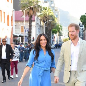 Le prince Harry, duc de Sussex, et Meghan Markle, duchesse de Sussex, en visite dans le District 6 au Cap dans le cadre de leur visite officielle en Afrique du Sud, le 23 septembre 2019.