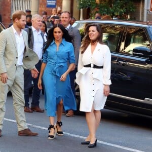 Le prince Harry, duc de Sussex, et Meghan Markle, duchesse de Sussex, en visite dans le District 6 au Cap dans le cadre de leur visite officielle en Afrique du Sud, le 23 septembre 2019.