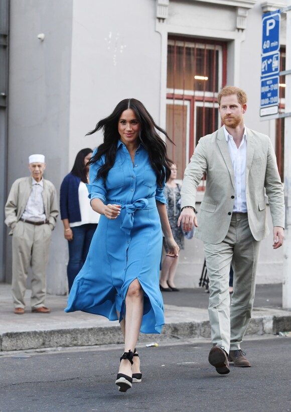 Le prince Harry, duc de Sussex, et Meghan Markle, duchesse de Sussex, en visite dans le District 6 au Cap dans le cadre de leur visite officielle en Afrique du Sud, le 23 septembre 2019.