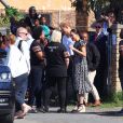 Le prince Harry, duc de Sussex, et Meghan Markle, duchesse de Sussex, quittent le township de Nyanga, au Cap en Afrique du Sud, le 23 septembre 2019