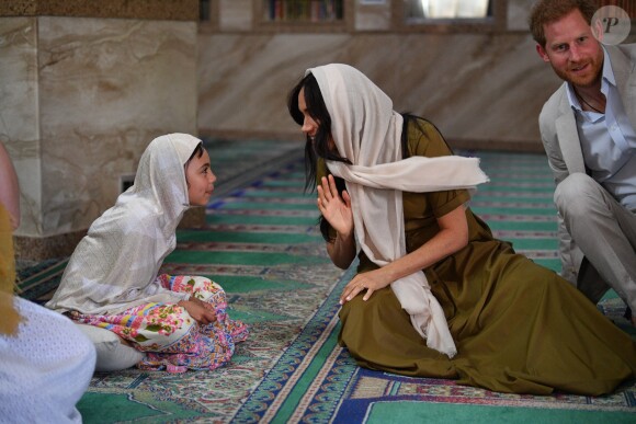 Meghan Markle, duchesse de Sussex, et le prince Harry ont visité la mosquée Auwal, la plus ancienne d'Afrique du Sud, dans le quartier de Bo-Kaap au Cap, le 24 septembre 2019 dans le cadre de leur visite officielle et de l'Heritage Day, un jour férié dans le pays.