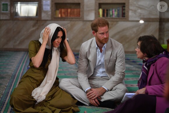 Meghan Markle, duchesse de Sussex, et le prince Harry ont visité la mosquée Auwal, la plus ancienne d'Afrique du Sud, dans le quartier de Bo-Kaap au Cap, le 24 septembre 2019 dans le cadre de leur visite officielle et de l'Heritage Day, un jour férié dans le pays.