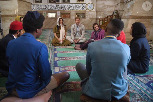 Meghan Markle, duchesse de Sussex, et le prince Harry ont visité la mosquée Auwal, la plus ancienne d'Afrique du Sud, dans le quartier de Bo-Kaap au Cap, le 24 septembre 2019 dans le cadre de leur visite officielle et de l'Heritage Day, un jour férié dans le pays.