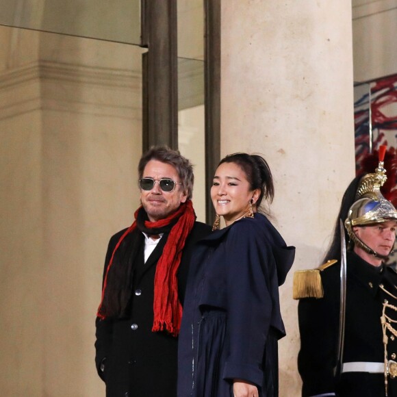 Jean-Michel Jarre et sa compagne Gong Li - Arrivées au dîner d'état en l'honneur du président de la république de Chine X.Jinping au Palais de L'Elysée, Paris, le 25 mars 2019. © Stéphane Lemouton / BestImage