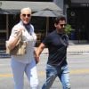 La comédienne danoise Brigitte Nielsen, 56 ans, et son mari Mattia Dessi, main dans la main, quittent le restaurant "Toast" après déjeuner à West Hollywood, le 16 juillet 2019.