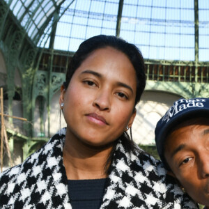 Helen Lasichanh et Pharrell Williams assistent au deuxième défilé Chanel, collection Haute Couture printemps-été 2020, au Grand Palais. Paris, le 21 janvier 2020.