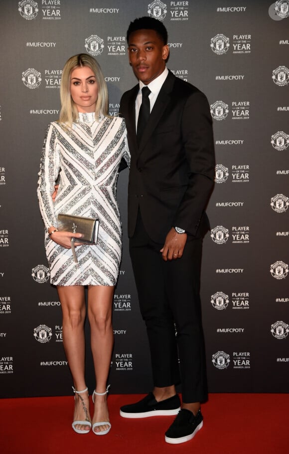 Anthony Martial et sa femme Mélanie Da Cruz lors de la soirée du prix du joueur de l'année de Manchester United 2019 au stade Old Trafford à Manchester, Royaume Uni, le 9 mai 2019.