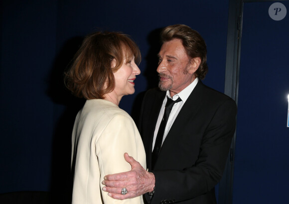Nathalie Baye et Johnny Hallyday - Avant-première de 'Salaud on t'aime' à l'UGC Normandie sur les Champs-Elysées à Paris le 31 mars 2014