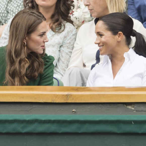 Catherine (Kate) Middleton, duchesse de Cambridge, Meghan Markle, duchesse de Sussex, et Pippa Middleton dans les tribunes lors de la finale femme de Wimbledon "Serena Williams - Simona Halep (2/6 - 2/6) à Londres, le 13 juillet 2019. © Ray Tang/London