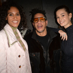 Cindy Bruna, JoeyStarr (Joey Starr) et Ophélie Guillermand lors de la vente aux enchères caritative à la soirée "Women for Women" aux Bains-Douches à Paris, France, le 27 février 2020, en marge de la semaine de la mode à Paris. La top model O.Guillermand et J.P.Marois, Propriétaire des Bains, ont réuni la mode en pleine fashion week pour une vente de charité au profit de Plan International France. Grâce aux généreuses donations de femmes photographes et avec le soutien gracieux de Maître A.Giquello, Président de Drouot Patrimoine,O.Guillermand a mis aux enchères une quinzaine de photographies de femmes prises par des femmes photographes au profit de programmes en faveur des droits des filles menés par l'ONG Plan International France. La soirée a permis de récolter 51 000 € grâce à la vente aux enchères de photographies signées par Ellen Von Unwerth, Sonia Sieff, Amanda Charchian, Ami Sioux, Anna Palma, Bibi Borthwick, Camilla Akrans, Carin Backoff, Carlotta Kohl, Charlotte Wales, Danielle Levitt, Emma Tempest, Maripol, Pamela Hanson, Posternak Tanya & Zhenya et Yulia Gorbachenko. © Veeren-Clovis/Bestimage