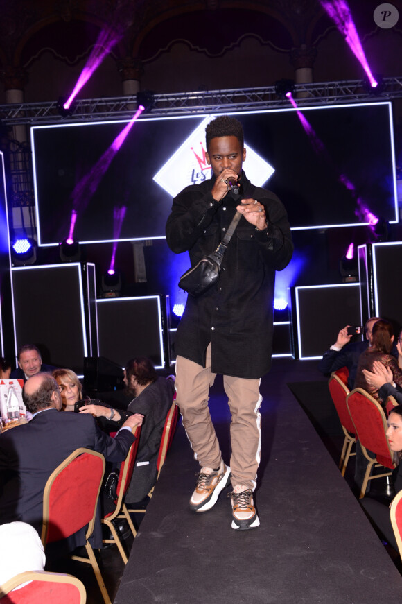 Exclusif - Black M (Black Mesrimes) - 8ème gala de l'association "Les Rois du Monde" avec un plateau d'artistes et une vente aux enchères au profit des enfants défavorisés, orphelins et hospitalisés, suivi d'une soirée dansante à la Salle Wagram à Paris, le 2 mars 2020. Le lancement de la traditionnelle vente caritative d'oeuvres d'artistes contemporains les plus prisés du moment a été bousculé avec la mise aux enchères spontanée de la guitare de Patrick Bruel, faisant s'envoler les dons. La suite de la vente s'est déroulée dans une ambiance électrique, avec pour commissaire-priseur C. Hanouna, soutien de la première heure des Rois du Monde. Enfin, l'association a annoncé hier soir son implication de plus en plus forte à l'international, les actions à venir pour l'année 2020, et la sortie du livre de la présidente Stéphanie Robert : "Solide et solidaire. Les Rois du Monde s'engagent aujourd'hui d'avantage à l'international et oeuvrent en faveur du financement de programmes locaux axés sur l'éducation, la santé, l'alimentation, le développement durable et les droits des enfants. Une ambition toujours plus forte pour l'association qui se mobilise chaque jour, grâce aux dons et à ses partenaires, mécènes et personnalités, pour rendre meilleure la vie des enfants défavorisés. © Cyril Moreau-Rachid Bellak/Bestimage