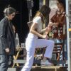Kendall Jenner est allée déjeuner avec des amis au restaurant Croft Alley dans le quartier de West Hollywood à Los Angeles. Elle porte un jean taille haute blanc, un sac Louis Vuitton et un crop top sans soutien gorge. Le 11 mars 2020.