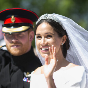 Le prince Harry, duc de Sussex, et Meghan Markle, duchesse de Sussex, en calèche au château de Windsor après la cérémonie de leur mariage au château de Windsor, Royaume Uni, le 19 mai 2018.