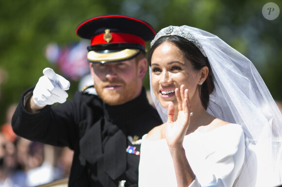 Le prince Harry, duc de Sussex, et Meghan Markle, duchesse de Sussex, en calèche au château de Windsor après la cérémonie de leur mariage au château de Windsor, Royaume Uni, le 19 mai 2018.