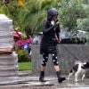 Exclusif - Nina Dobrev promène son chien Maverick sous la pluie près de sa maison de Los Angeles, pendant le confinement dû au coronavirus (Covid-19), le 9 avril 2020.