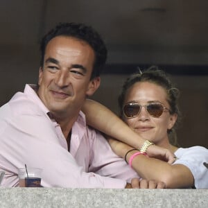 Olivier Sarkozy et Mary-Kate Olsen complices lors du tournoi de l'US Open à Flushing le 1er septembre 2014.